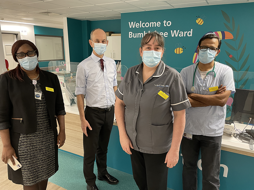 Dr Chris Streather with Dr Gubby Ayida and others in Bumblebee children's ward